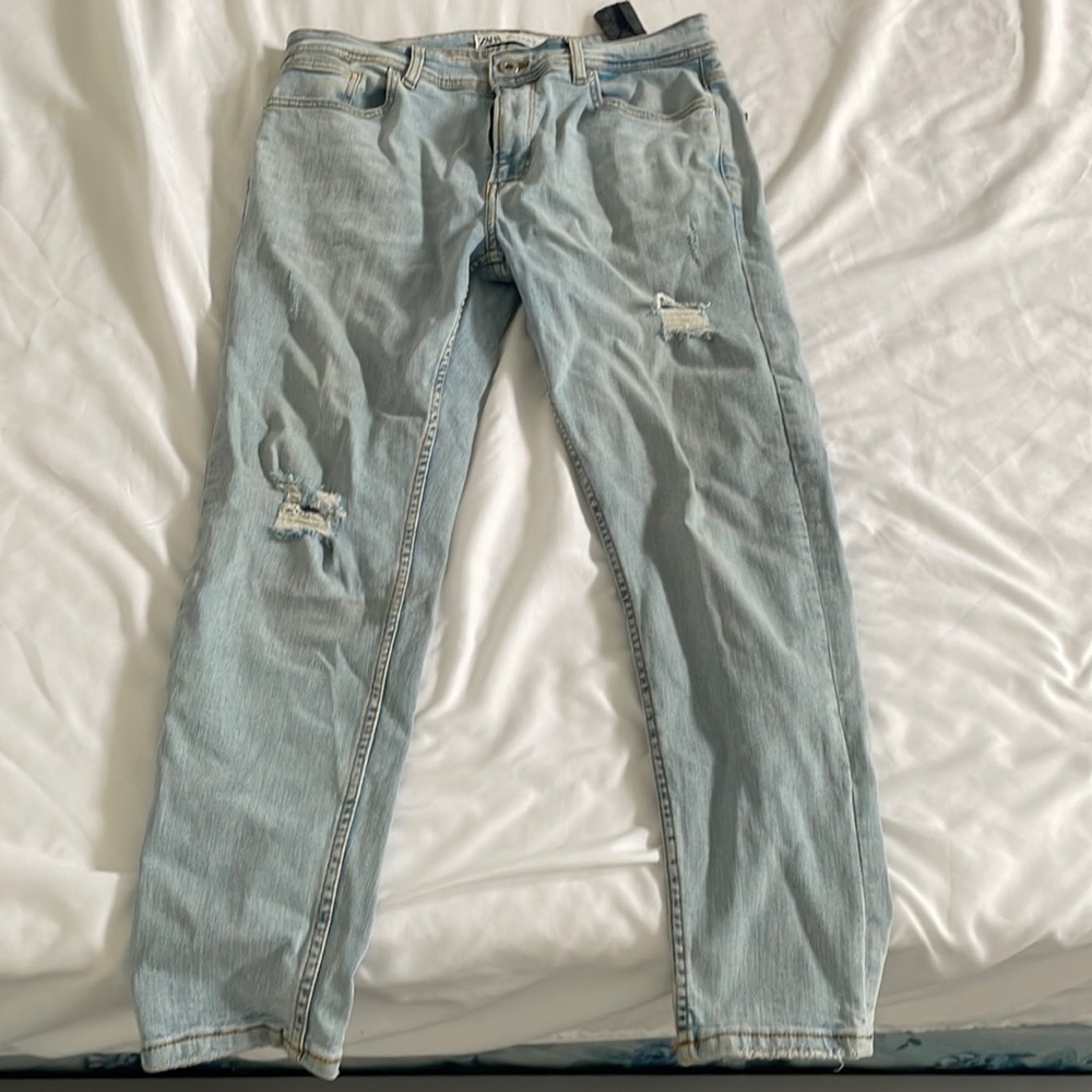 Zara’s skinny fit destroyed light blue jeans.